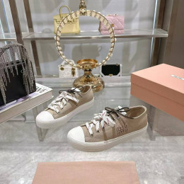 Кеды Miu Miu бежевого цвета