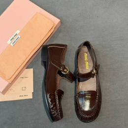 Лоферы Miu Miu коричневого цвета